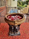 Art and Tradition of Multiple Elephant Statues holding Big Bowl with flowers in the water at entrance of Hindu Marriage and Events