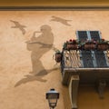 Art On House Wall: Saxist And Pigeons Made Of Chicken Wire