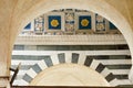 fine ceramic and marble decoration under archway in Italy