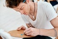 Art is what you make others see. a handsome young artist squeezing paint onto a palette during an art class in the Royalty Free Stock Photo