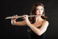 Art. Woman flutist flaustist musician playing flute Royalty Free Stock Photo