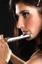 Art. Woman flutist flaustist musician playing flute Royalty Free Stock Photo
