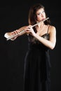 Art. Woman flutist flaustist musician playing flute Royalty Free Stock Photo