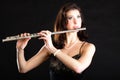 Art. Woman flutist flaustist musician playing flute Royalty Free Stock Photo