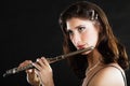 Art. Woman flutist flautist playing flute. Music.