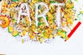 ART word on the background of colored pencil shavings Royalty Free Stock Photo