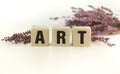 ART word written on wooden blocks on wooden table. Concept for your design Royalty Free Stock Photo