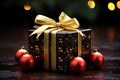 Christmas gift box with red baubles and golden bow on dark background.Generative AI Royalty Free Stock Photo