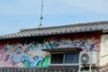 Art work on a Japanese house against the sky