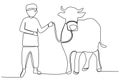 A boy holding a sacrificial cow Royalty Free Stock Photo