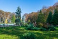 Artesian fountain in an autumn landscape in Roman Park, Romania