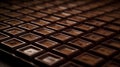 Artful chocolate tiling, Close-up view of carefully crafted dark chocolate squares.