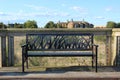 Artful metal garden bench on a boardwalk