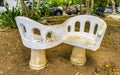 Artfully curved stone bench in city park Playa del Carmen