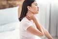 Korean Woman Having Neck Pain Sitting In Bed At Home Royalty Free Stock Photo