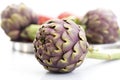 Artichoke in front of other artichokes