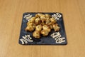 Artichoke hearts battered and fried in olive oil with sauce to accompany