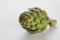 Artichoke on white table Royalty Free Stock Photo