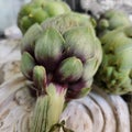 Artichokes and background from vintage rustic decorative element. Wood carving.