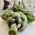 Artichokes and background from vintage rustic decorative element. Wood carving.