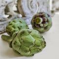 Artichokes and background from vintage rustic decorative element. Wood carving.