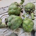 Artichokes and background from vintage rustic decorative element. Wood carving.