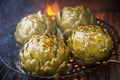 Artichokes in pan charred on BBQ with smoke and flames Royalty Free Stock Photo