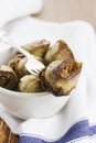 Artichokes in plates or bowl with fork Royalty Free Stock Photo