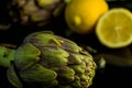 Artichokes posed and lemon on background Royalty Free Stock Photo