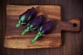 Artichokes, small, violet on a cutting board