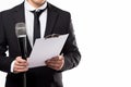 Articulate Man holding microphone and clipboard on white. Generate Ai Royalty Free Stock Photo