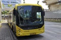 Articulated city bus in yellow colour of U-OV in the city of Utrecht runned by QBUZZ