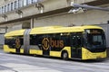 Articulated city bus in yellow colour of U-OV in the city of Utrecht runned by QBUZZ