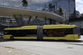 Articulated city bus in yellow colour of U-OV in the city of Utrecht runned by QBUZZ