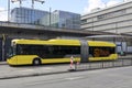Articulated city bus in yellow colour of U-OV in the city of Utrecht runned by QBUZZ