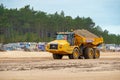 Articulated Dumper Truck transporting sand on Wells beach. Royalty Free Stock Photo