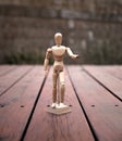 Articulating Wood Drawing Mannequin on Wooden Deck Royalty Free Stock Photo