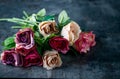 Artificial antique roses on stony background. Royalty Free Stock Photo