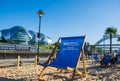 Artificial beach setting with sand and beach chairs on a beautiful summer afternoon at Newcastle Quayside with Sage Gateshead and Royalty Free Stock Photo