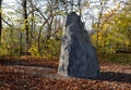 Artificial boulder in shape of an alpine mountain or dragon tooth. used to train climbers in a city park. The top stone is made of