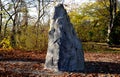 Artificial boulder in shape of an alpine mountain or dragon tooth. used to train climbers in a city park. The top stone is made of