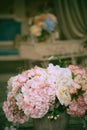 Artificial bouquet on the piano. Decorative vintage piano in the interior Royalty Free Stock Photo