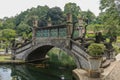 An artificial bridge with four statues of dragons with twisted tails, Tirta Gangga park, Karangasem region of Bali Royalty Free Stock Photo