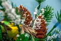 Artificial brown cone sprinkled on a handmade Christmas tree