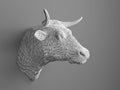 Artificial bull's head hanging on the wall. Polygonal head of a bull. Cows from the three-dimensional grid. The object of art on t Royalty Free Stock Photo