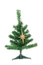 Artificial Christmas tree with golden star Royalty Free Stock Photo