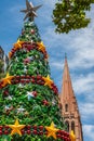 Artificial Christmas tree and Saint Pauls spire, Melbourne, Australia Royalty Free Stock Photo