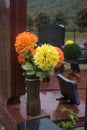 artificial chrysanthemums flowers on tomb at the cemetery