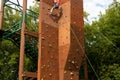 An artificial climbing wall created for children on the playground. Training in basic skills of extreme sports Royalty Free Stock Photo