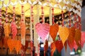 Artificial colorful mobile leaf of bodhi tree hanging balanced on background